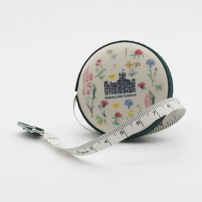 Fabric bound retractable tape measure